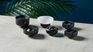 Six Moment smartphone lenses sitting on a table