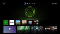 Xbox home screen with a large green Xbox logo. App icons include YouTube and HBO Max. Options for browsing the store and viewing current offerings like UFC 6. Time displayed: 18:30.