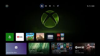 Xbox home screen with a large green Xbox logo. App icons include YouTube and HBO Max. Options for browsing the store and viewing current offerings like UFC 6. Time displayed: 18:30.