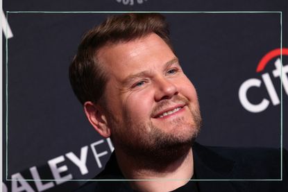 an extreme close up of James Corden smiling on the red carpet of The Late Late Show
