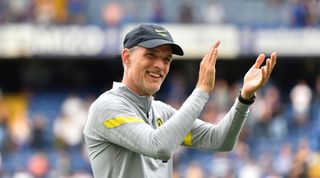 Chelsea head coach Thomas Tuchel, smiling and applauding the fans