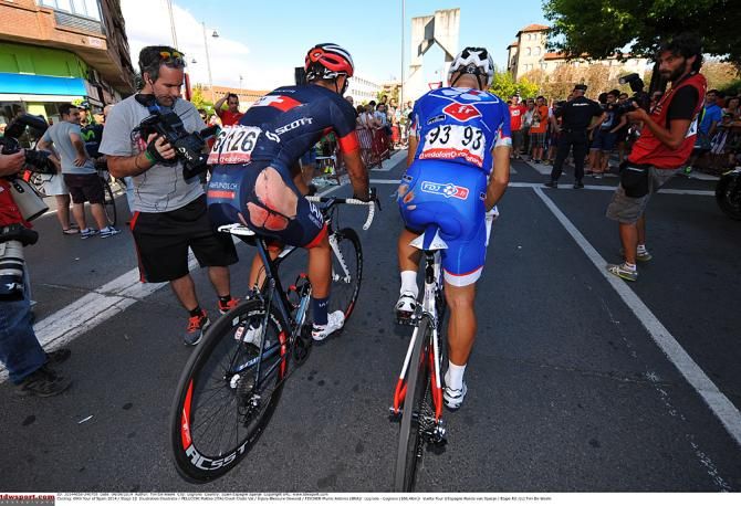 Riders roll to the finish line after being involved in a late-race crash
