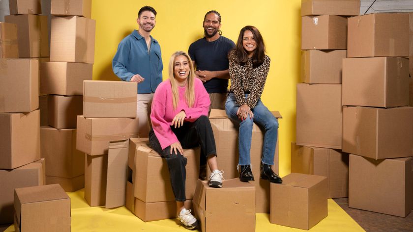 Iwan Carrington, Stacey Solomon, Rob, Bent, Dilly Carter sitting on cardboard boxes and in front of a yellow background 