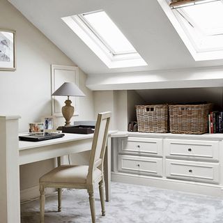 neutral home office with natural lighting and lamp