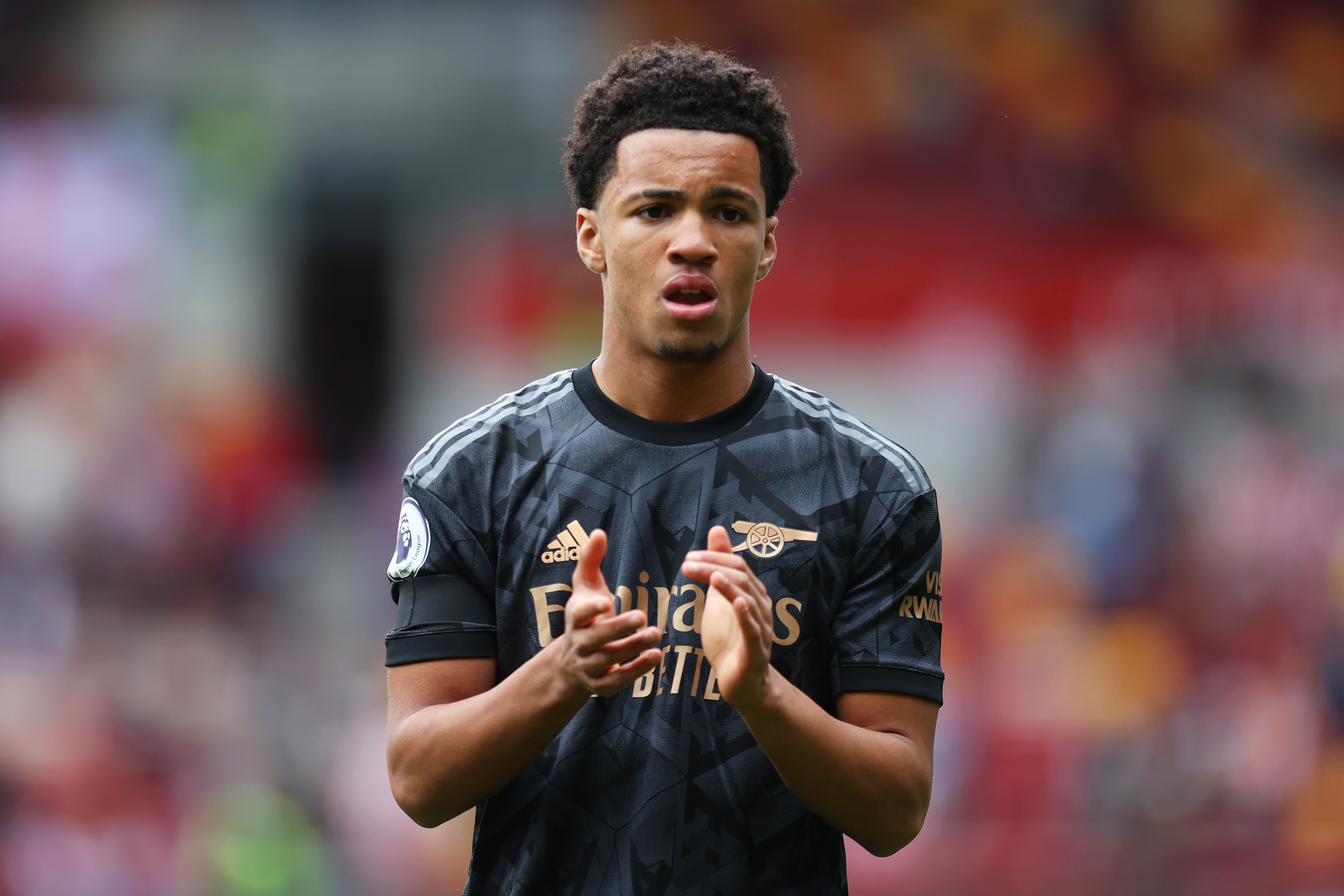 Ethan Nwaneri applauds the Arsenal fans after his debut against Brentford in September 2022.