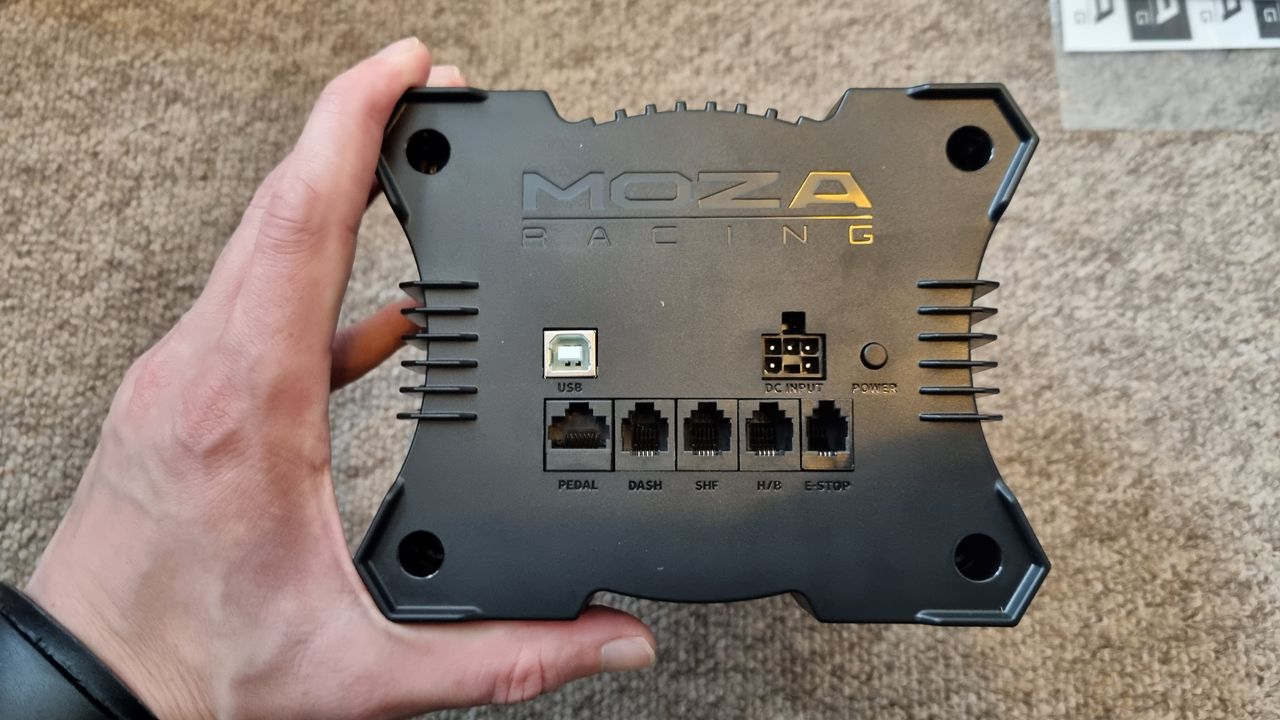 The rear of the MOZA R5 wheelbase, showing the connection ports
