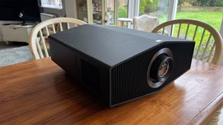 Sony Bravia Projector 9 home cinema projector on wooden dining table