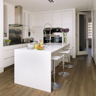 white kitchen with white worktops