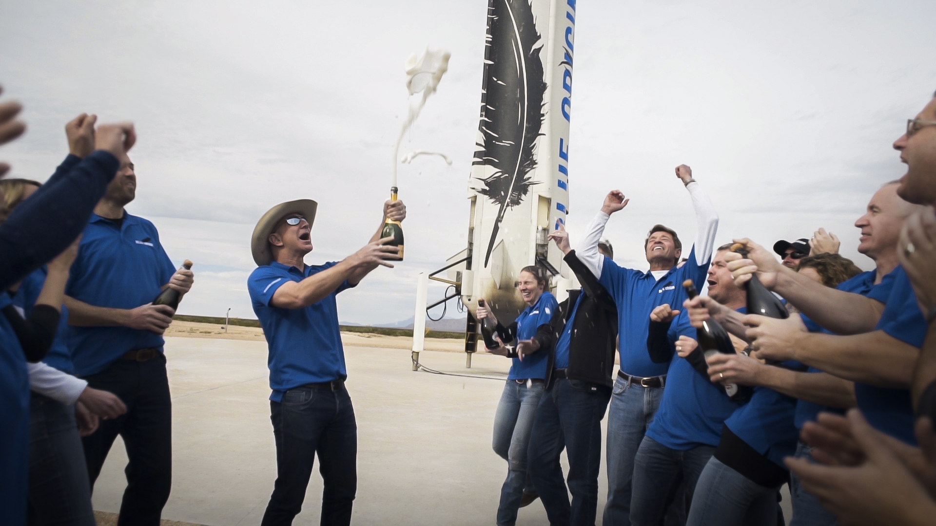 Jeff Bezos and Blue Origin staff celebrate the successful landing of a New Shepard rocket.