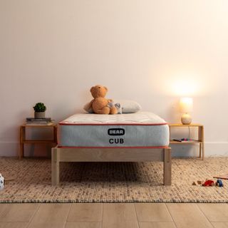 Bear Cub Kids' Mattress against a white wall.