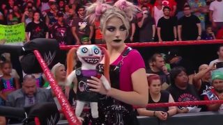 Alexa Bliss with Lilly in the ring WWE