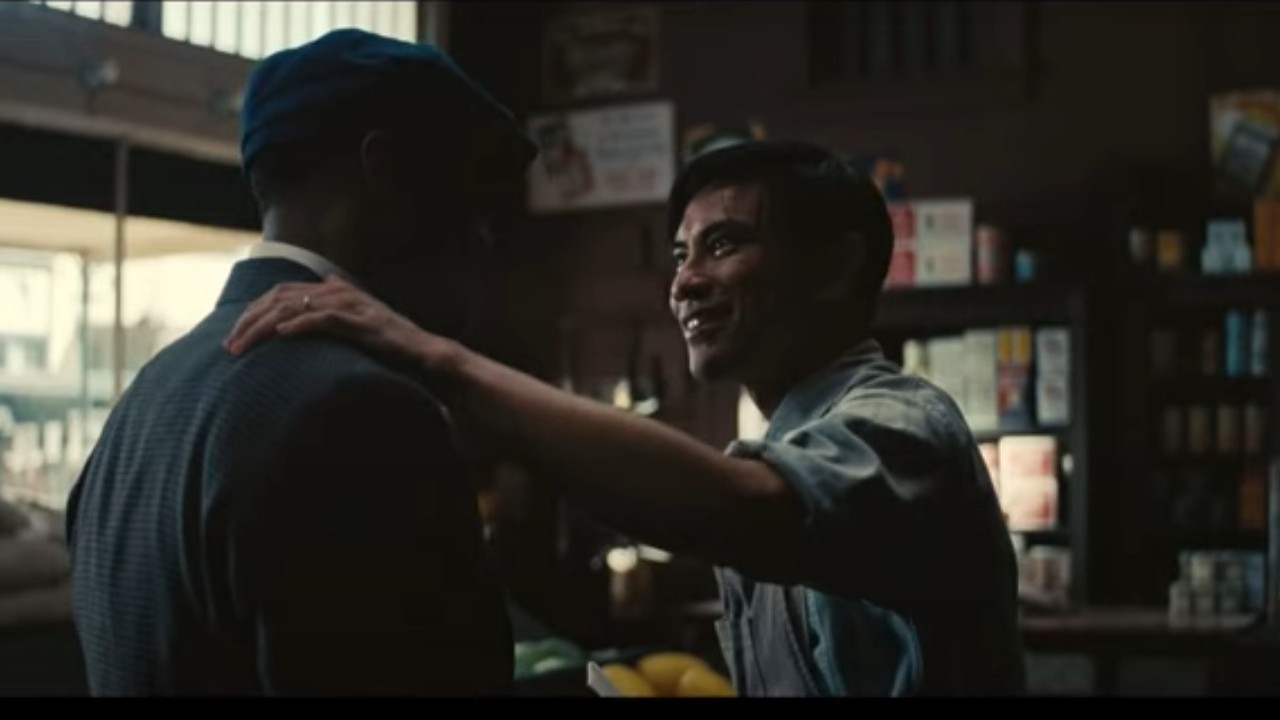 Yao with his hand on Michael B. Jordan's shoulder in Sinners