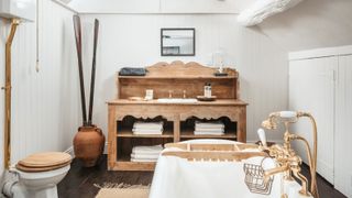 Rustic bathroom with vintage wooden vanity unit