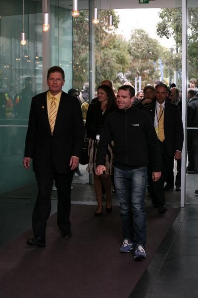 Evans enters the press conference with Victorian Premier Ted Baillieu