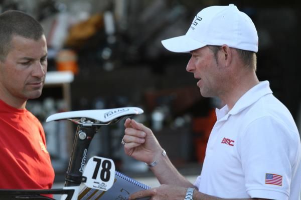Mike Sayers describes a transfer schedule to Ian Sherburne. The DS takes on many more responsibilities other than just guiding racers. Here, Sayers is trying to find a solution for moving the large team bus to a more efficient departure time.