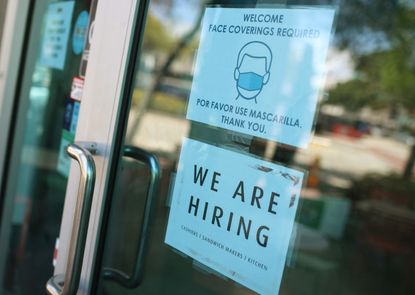 A 'we are hiring' sign in front of a store on March 05, 2021 in Miami, Florida.