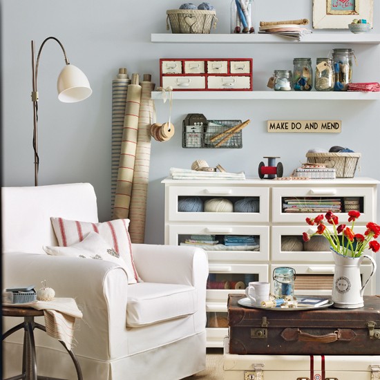 living room with floor lamp and white chest of drawers