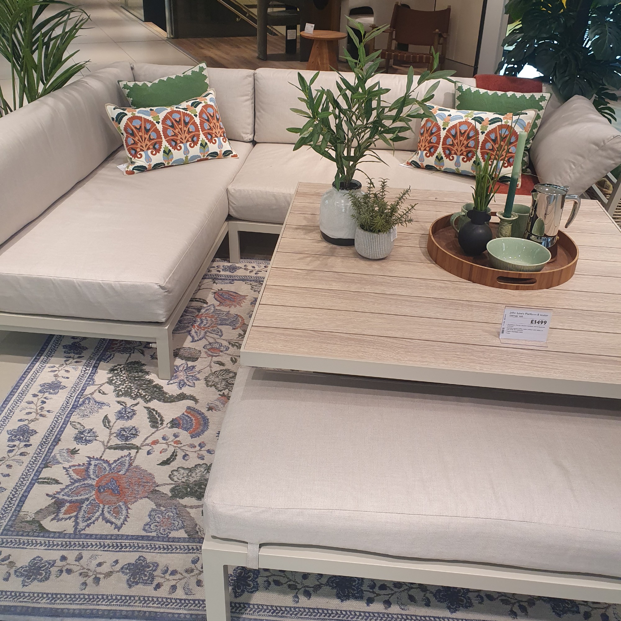 The John Lewis Platform 8-Seater Corner Garden Dining/Lounge Set with Height-Adjustable Table in taupe at the John Lewis store on Oxford Street
