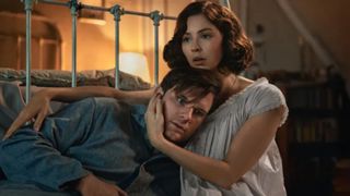 Julia holds Jamie's head while embracing him