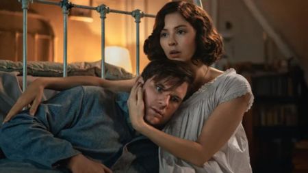 Julia holds Jamie's head while embracing him