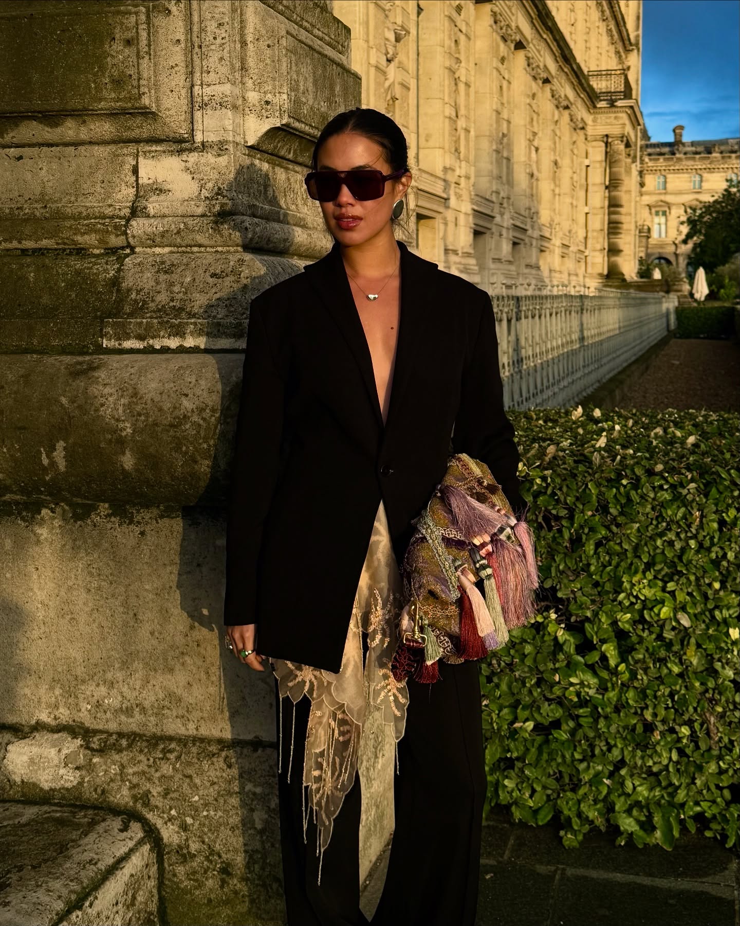 An image of @sasha.mei wearing a tassel clutch bag, one of the biggest fashion trends for spring 2026.