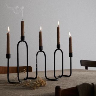 A wavy candle holder with five candles from H&M Home