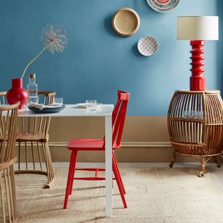 dining room with red chair and vase