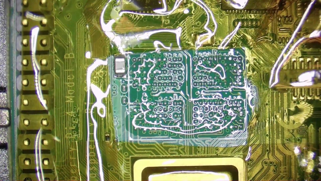 Replacing the 1GB RAM chip on a Raspberry Pi 4 with an 8GB RAM chip.
