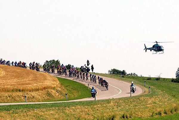 The bunch comes through with the TV helicopter hot on their heels.