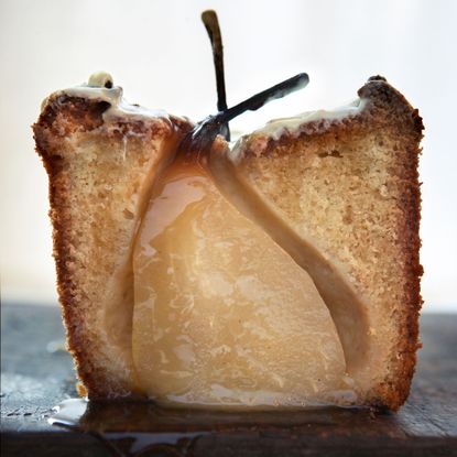 Cardamom cake with whole pears and white chocolate photo