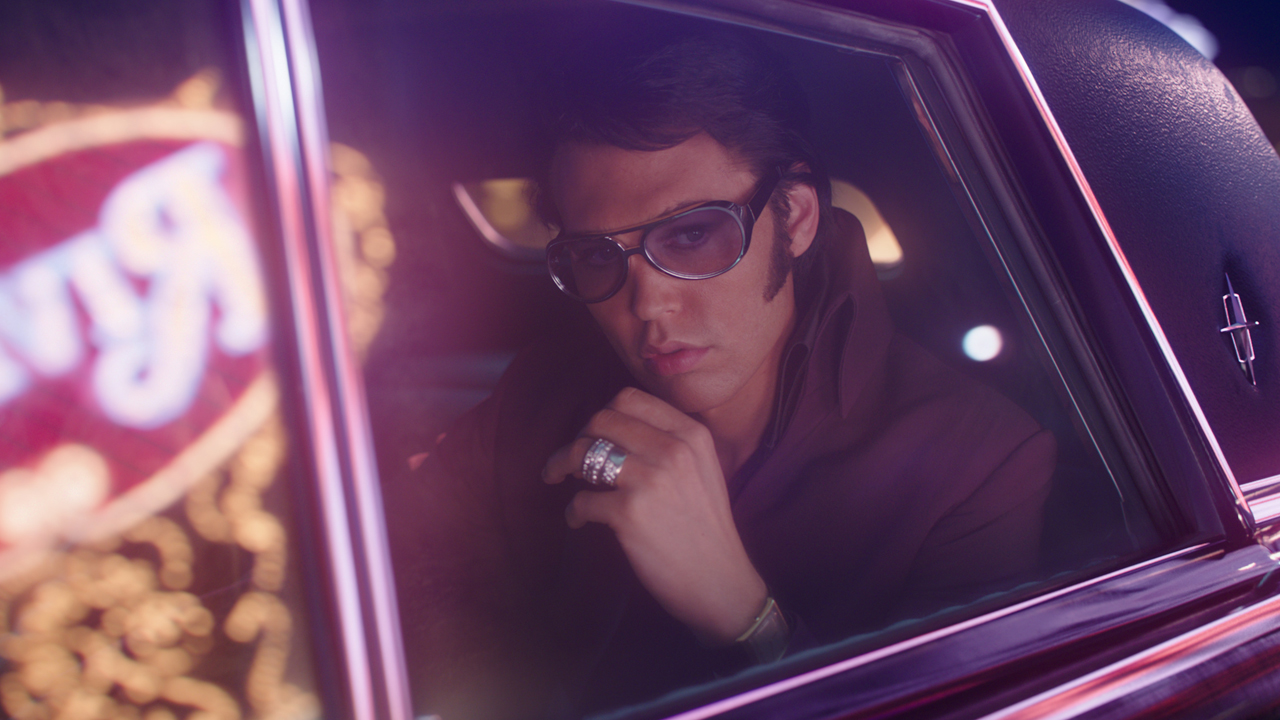 Austin Butler as Elvis riding around in a limo in Elvis