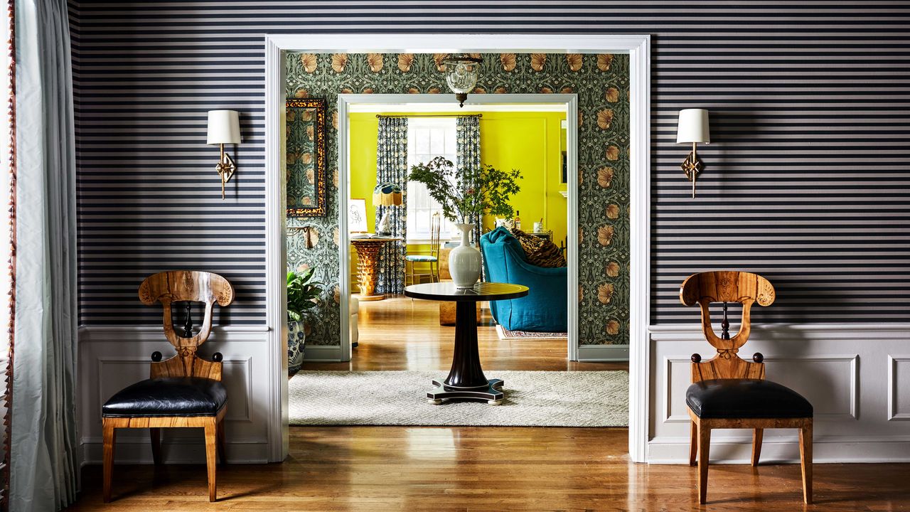 a view into a hallway and living room with a bright chartreuse wall color