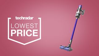 Dyson V11 cordless vacuum on a light pink background, beside text that reads 'lowest price'