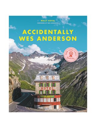 Accidentally Wes Anderson book features an alpine view of an old-style hotel sitting in front of a series of mountains.