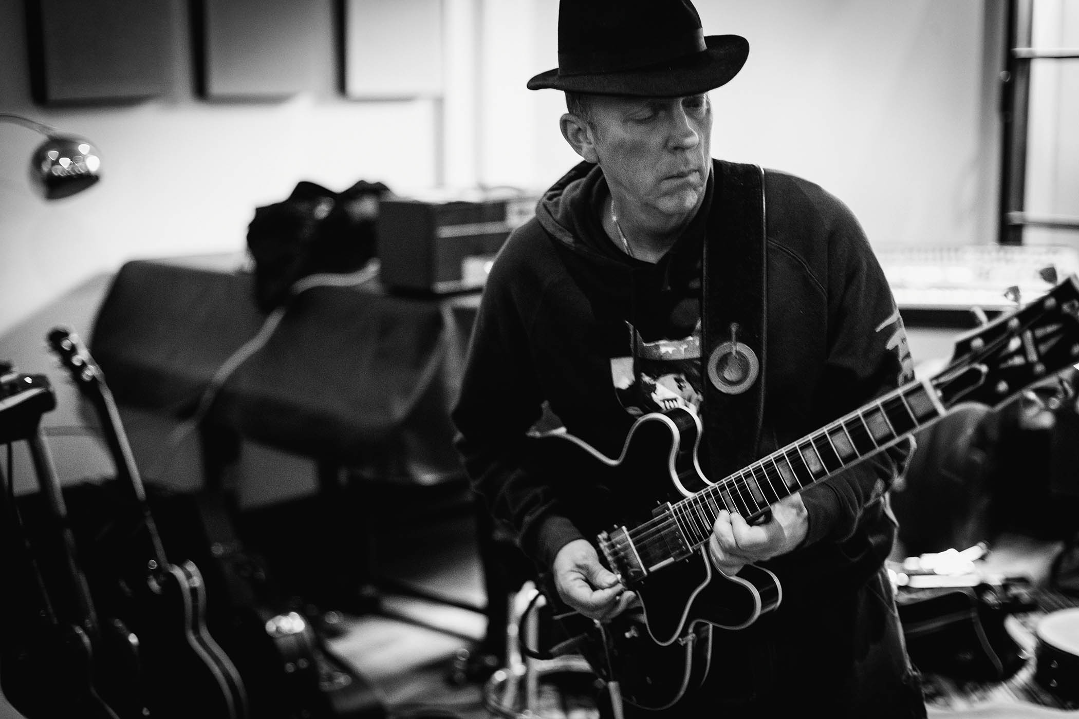 A black-and-white shot of Stephen Dale Petit playing his Gibson ES-355