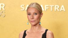 Gwyneth Paltrow is pictured with her hair in a low-bun style, and wearing a black dress and pink-nude, sparkly lip gloss at the 32nd Annual Actor Awards at Shrine Auditorium and Expo Hall on March 01, 2026 in Los Angeles, California. 