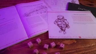 Character sheets, dice, and the Adventure Book from The One Ring Starter Set