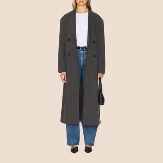 Flat lay image of woman wearing trench coat