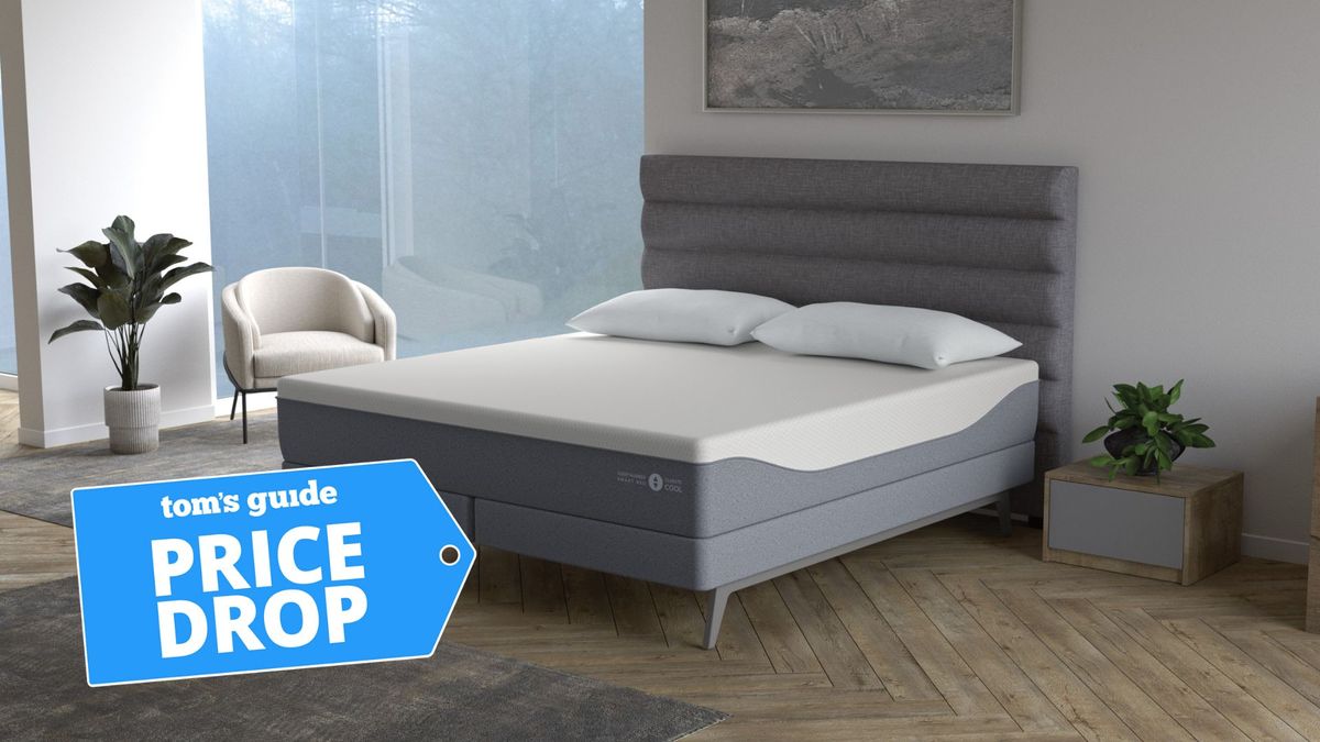 Sleep Number ClimateCool smart mattress with grey base and white top in room with wooden floor and Tom&#039;s Guide price drop log