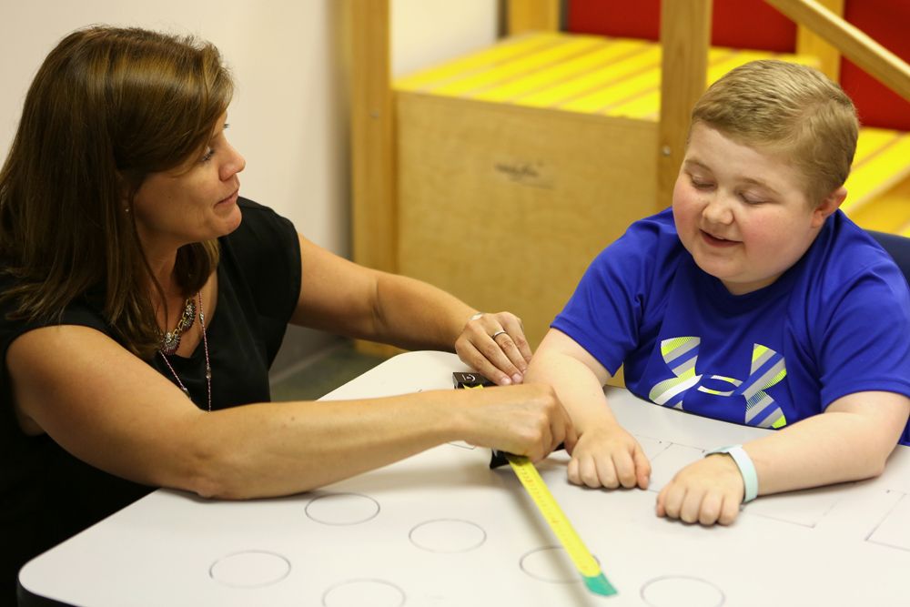 Linda Lowes and patient, muscular dystrophy