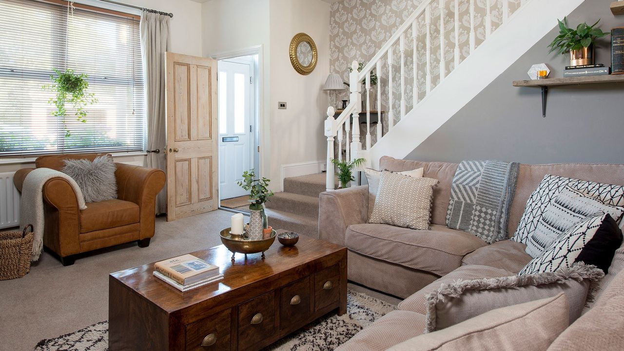 living room with white wall and stairs