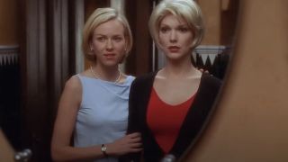 Betty standing with Rita trying on a blonde wig in Mulholland Drive