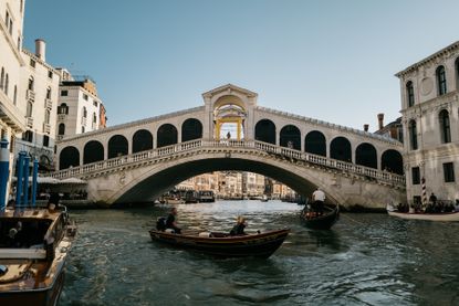 Quannah Chasinghorse performs on Venice’s Rialto Bridge as part of Golden Goose ‘Haus of Dreamers’