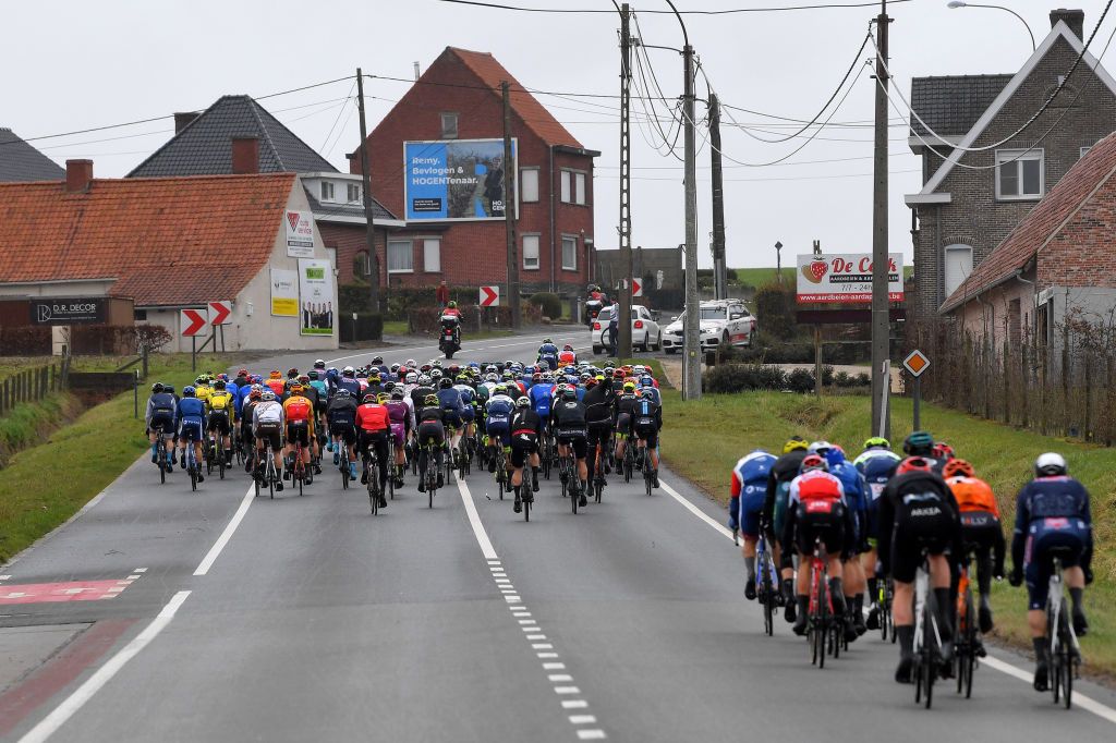 NOKERE BELGIUM MARCH 17 The peloton during the 75th Nokere Koerse Danilith Classic 2021 Mens Elite a 1955km race from Deinze to Nokere Village Landscape NokereKoerse on March 17 2021 in Nokere Belgium Photo by Luc ClaessenGetty Images