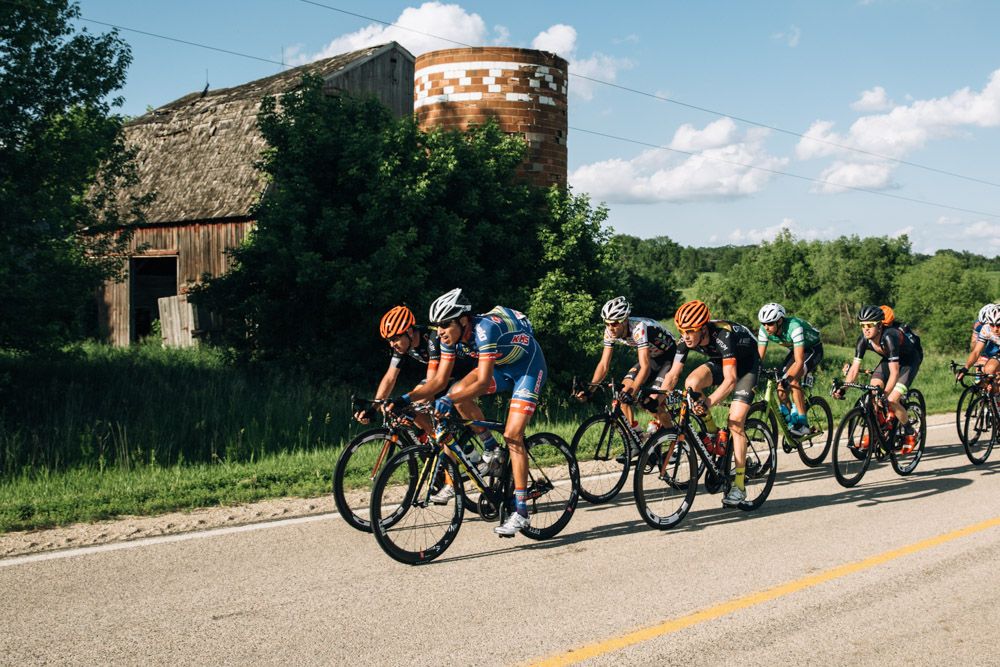 The breakaway rolls by a dilapidated old farm house