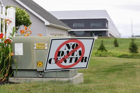  A "No Data Center" yard sign is displayed in front of a house in opposition to a proposed 300-megawatt data center at Great Stream Commons industrial park. 