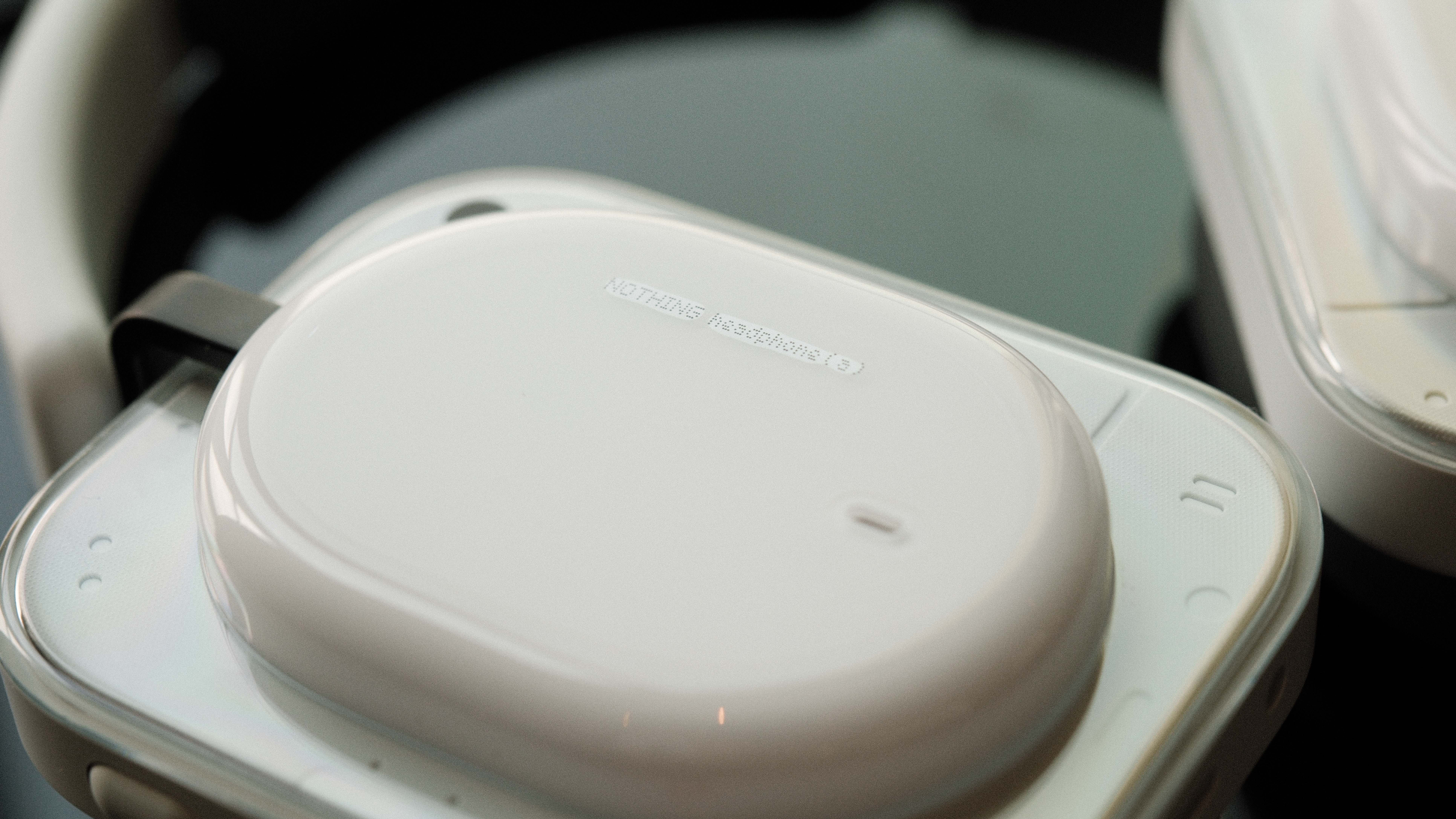 Close-up of Nothing Headphones (a) ear cup and case