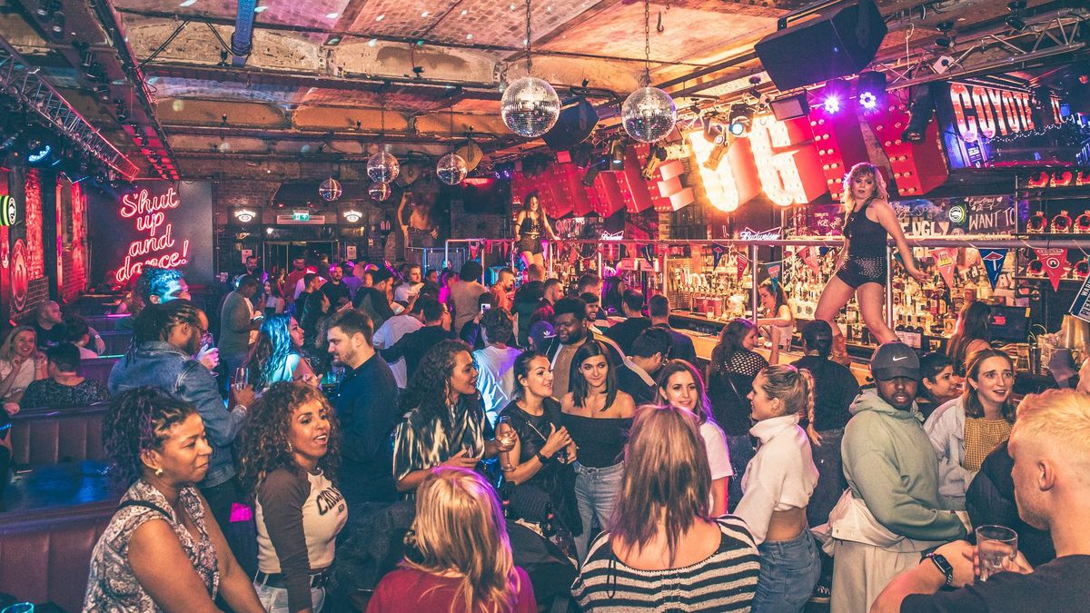 A crowd having fun on the dance floor at Coyote Ugly thanks to sounds from Renkus-Heniz.