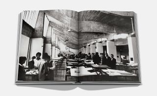 Two page black and white spread of people sitting and standing around tables
