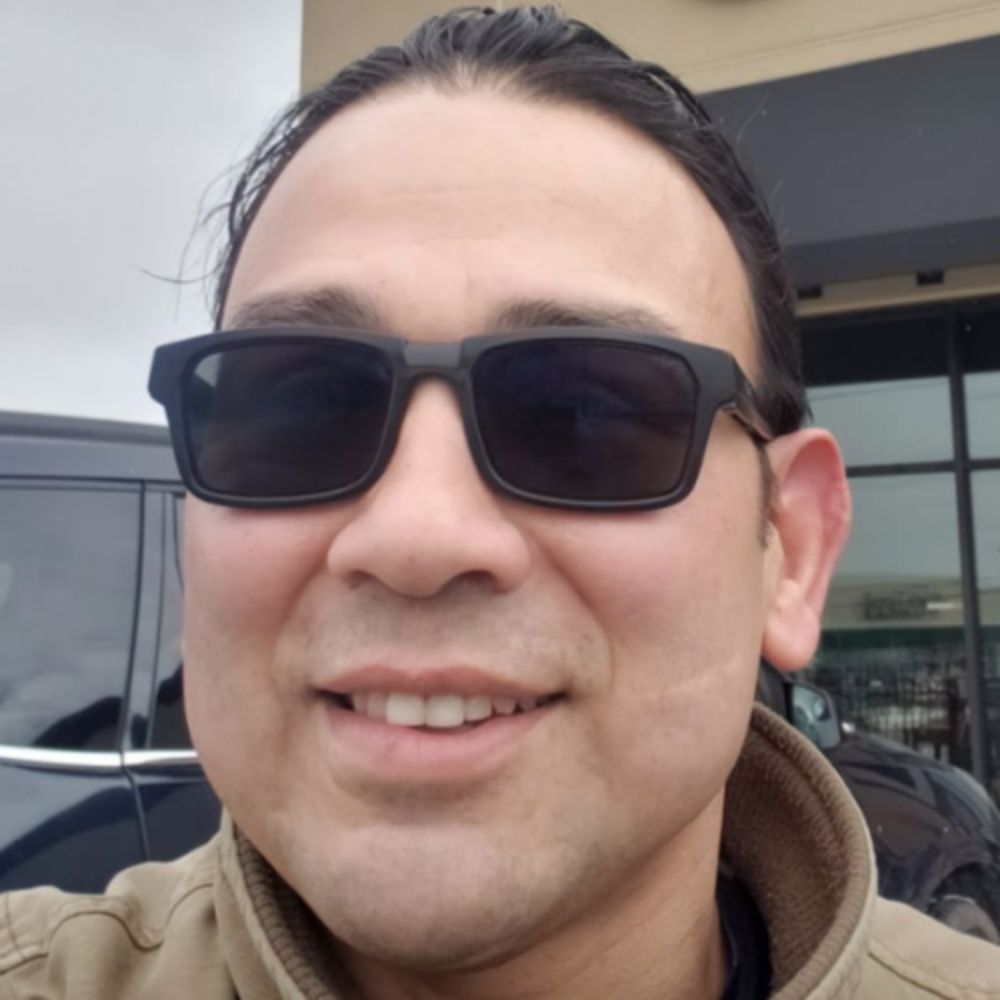 A headshot of Armando Calderon